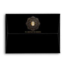 a black envelope with the words it's once robinns on it and a golden lock