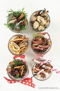 four glass bowls filled with different types of food and spices on top of each other