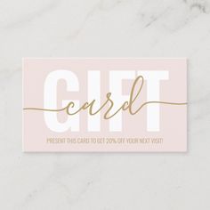 a gift card with the word'gift'in gold foil on a white marble background