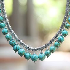 This breathtaking statement necklace is the creation of Bali's Zayd Makarim. Tubular sterling silver beads all decorated with Makarim's signature 'Buddha's curl' motif are strung on a thick sterling chain. Each bead is adorned with a dangling bauble of sky-blue reconstituted turquoise. The substantial necklace is secured by an ornate push-button clasp. Cheap Vintage Necklaces With Silver Beads, Cheap Oval Beads Jewelry For Festivals, Silver Statement Necklace, Bali Silver, Basic Jewelry, Silver Necklace Statement, Sterling Silver Charm Bracelet, Silver Charm Bracelet, Sterling Silver Dangle Earrings