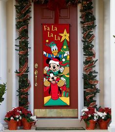 a mickey mouse christmas door with decorations