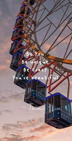 a ferris wheel with the words, be you and be unique to be early if you're beautiful