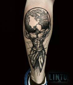 a man's leg with a black and white tattoo on it, holding the world in his hands