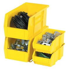 two yellow bins filled with various electrical wires and other items on a white background