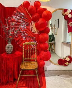 a chair and table with red decorations on it