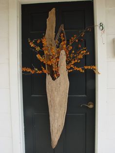 a large piece of driftwood sitting on top of a door