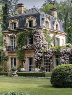 a large building with lots of windows and flowers on it