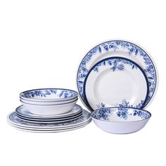 the blue and white dishes are stacked on top of each other