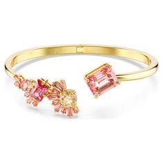 a gold bracelet with pink and yellow stones on the front, and an orange diamond in the back