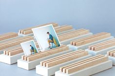 there is a photo frame sitting on top of some white blocks with wood slats