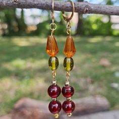 Rustic Bohemian Gold Earrings; Crafted With Red, Green, And Orange Czech Glass Beading. Handmade By Me, One Of A Kind. Hypoallergenic Gold-Plated Brass Leverback Hooks. Nickel Free. Length: 7 Cm Weight Per Earring: 4 Grams Note: If Any Item Has Flaws Or Wear And Tear, It Will Be Pictured And Included In The Description. Big Funky Earrings, Vintage Beaded Earrings, Fall Bead Jewelry, Retro Red Dangle Earrings, Handmade Retro Dangle Earrings, Handmade Burgundy Drop Earrings, Handmade Burgundy Dangle Earrings, Vintage Red Single Earring, Green Earrings Outfit