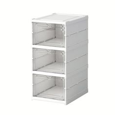 three white shelves stacked on top of each other