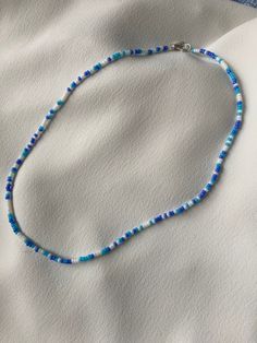 Blue and white Summer style/aesthetic Necklace. Outerbanks style. Made from light and darker blue and white seed beads. Great gift, gift for him, gift for her.  Comes in different sizes so fits everybody.  Feel free to message if you have any questions Beads Summer Necklace, Seed Bead Summer Necklace, Aesthetic Bead Necklaces, Blue Necklace Aesthetic, Diy Seed Bead Necklace, Summer Seed Bead Necklace, Summer Necklace Ideas, Beads Necklace Aesthetic, Seed Bead Necklace Ideas