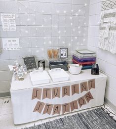 a white table topped with lots of books