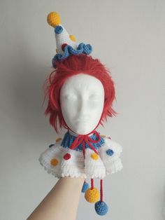 This crochet clown set includes a hat and a collar. Yarn material: acrilyc  It is a made to order set, which means when you place your order, we will be making this set specifically for you.  The hat can either come with straps or a hairband. The length of the straps for the hat are approx. 50cm (19.7 inches) The length of the straps for the collar are approx. 35cm (13.8 inches) The circumference of the neck is approx. 33cm (13 inches) Share Crochet Clown Accessories, Clown Hat Crochet, Drag Halloween Costume, Crochet Clown Costume, Diy Clown Hat, Crochet Clown Hat, Clowncore Crochet, Crochet Clown Collar, Crochet Party Hat