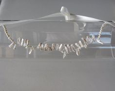 This Ivory Halo Pearls Headband with Ivory Satin Ribbon Tie is a beautiful piece for Bridal, Weddings, Party, and other Special Occasions. It is elegant, stylish, pretty, and chic!! It is a very unique piece that will definitely add a fashionable flair to your special event. Perfect for Spring......** Freshwater Pearl Design is 16 inches in length. Ivory Satin Ribbon Tie is 40 inches in length. I only accept PayPal and ship all orders within 24 hours via USPS.Feel free to send me a convo with an How To Make Fascinators, Headband Pearl, Pearl Design, Pearl Headband, Sequin Beading, Flower Applique, Ribbon Tie, Flower Headband, Polish Jewelry