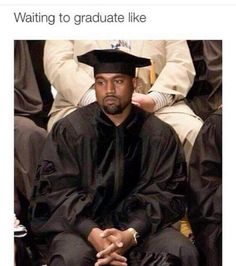 a man in graduation cap and gown sitting down