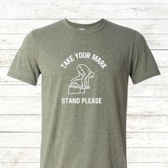 a t - shirt that says take your mark, stand please