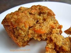 two pieces of carrot muffin on a white plate