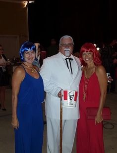 two women and an older man dressed in costume