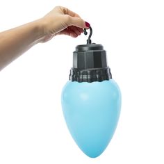 a hand holding a blue light bulb on a white background