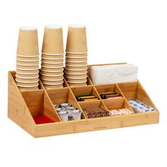 a wooden tray filled with lots of plates and cups on top of eachother