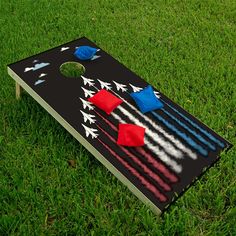 an american flag themed cornhole game on the grass