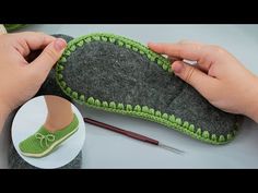 someone is making a slipper out of felt