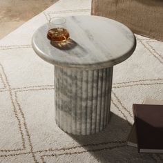 a marble table with a glass on top