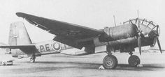 an old airplane is parked on the tarmac