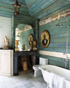 an old fashioned bathroom with wood paneling on the walls and ceiling, along with a white bathtub