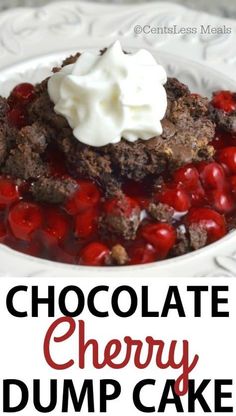 chocolate cherry dump cake on a white plate with whipped cream and cherries in the middle