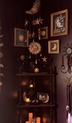 a shelf with candles and pictures on it in a room filled with other items such as clocks