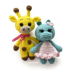 two crocheted stuffed animals sitting next to each other