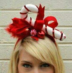 a woman with blonde hair wearing a candy cane headband