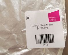 the label for silver foil from bullseye is displayed on a piece of aluminum foil