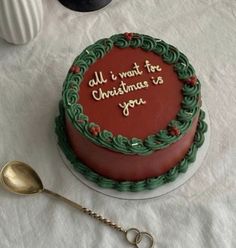 a christmas cake on a table with a spoon