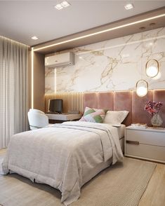 a bedroom with marble walls and white bedding