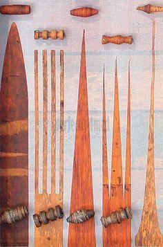 an assortment of wooden tools displayed on a white background