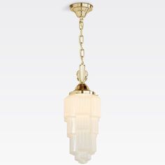 a light fixture with a glass shade hanging from the ceiling