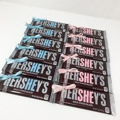 hershey's chocolate bars are stacked on top of each other with blue ribbons