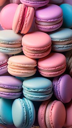 many different colored macaroons in a basket