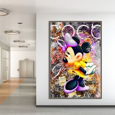 a mickey mouse painting hanging on the wall