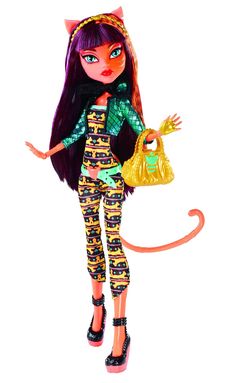 the doll is holding a purse in her hand and cat ears on it's head