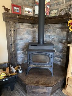 a wood burning stove sitting inside of a living room