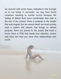 a woman sitting on top of a sandy beach next to the ocean with a quote written above her