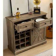 an entertainment center with wine bottles and other items on it's stand, next to a piano