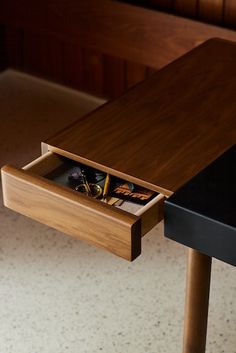 an open drawer on the side of a table