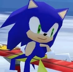 the sonic character is sitting on top of a red object in an animated video game