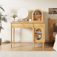 a bedroom scene with focus on the bed and vanity table, which has a round mirror above it